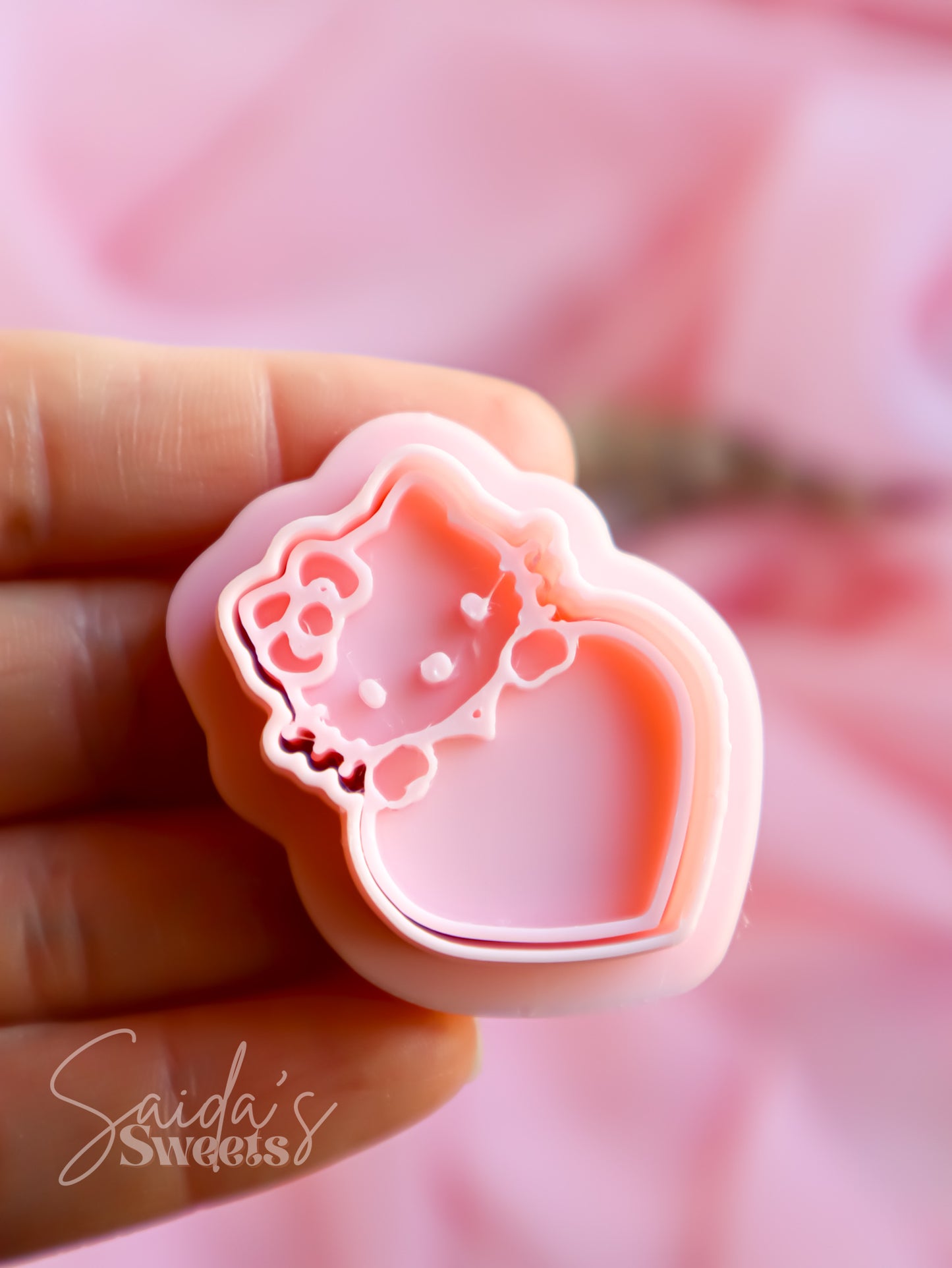 Kitty holding Heart Embosser & Cutters